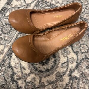 Tan ballet flats